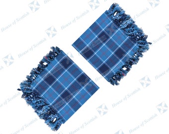 May include: Two square, blue tartan coasters with fringed edges. The coasters feature a classic plaid pattern in shades of blue, white, and red. The text "House of Scottish" is printed on the image.