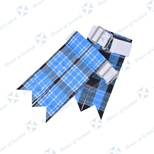 May include: A pair of blue and black tartan kilt hose with white elastic straps. The straps have white buckles.