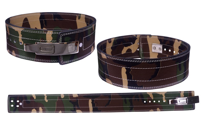 May include: A camouflage weightlifting belt with a silver buckle and multiple rows of stitching. The belt is made of leather and has a camouflage pattern.