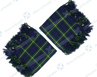 May include: Two blue and yellow tartan fabric squares with fringed edges. The fabric is a traditional Scottish tartan.