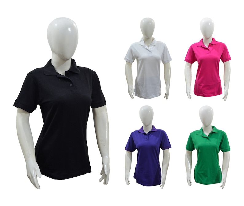 May include: Five mannequins wearing different colored polo shirts. The shirts are black, white, pink, purple, and green.
