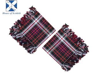 May include: Two square, fringed Scottish tartan coasters. The coasters feature a red, green, white, and black plaid pattern. The fringe is red, white, and black. The top left corner has the text "House of Scottish" and a logo.