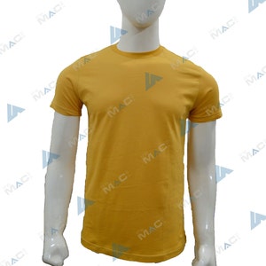 May include: Mustard yellow crew neck t-shirt. The short-sleeved shirt is displayed on a white mannequin. The shirt has a simple, classic design, suitable for casual wear. The fabric appears to be a soft, solid color.