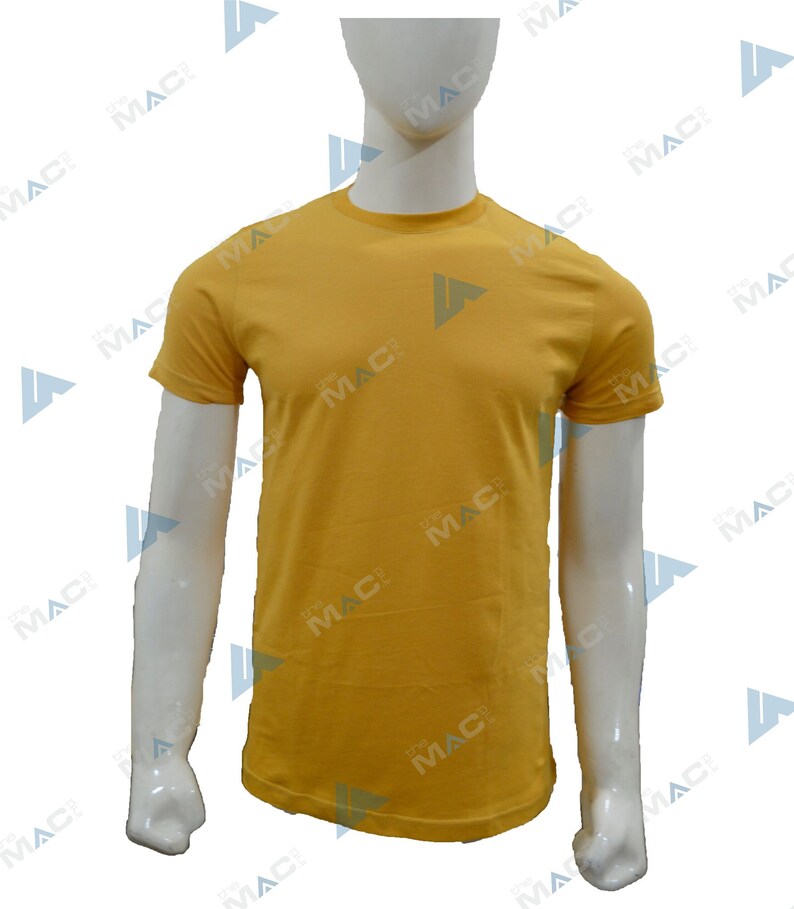May include: Mustard yellow crew neck t-shirt. The short-sleeved shirt is displayed on a white mannequin. The shirt has a simple, classic design, suitable for casual wear. The fabric appears to be a soft, solid color.