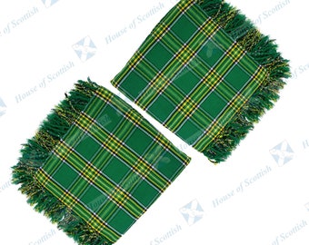 May include: Two green and yellow plaid fabric squares with fringed edges. The squares are folded in half and laid out on a white background.