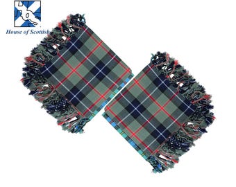 May include: Two green, blue, and red tartan kilt sashes with fringed edges.