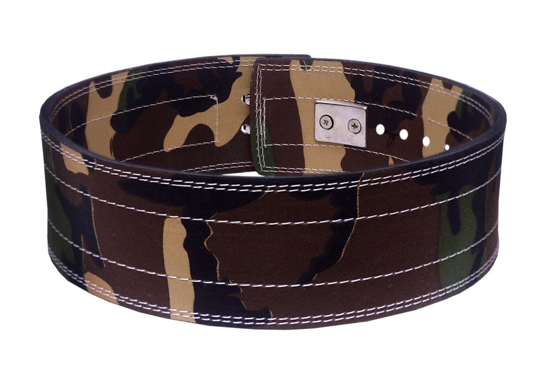 May include: A camouflage weightlifting belt with a black leather strap and a silver buckle. The belt has white stitching and multiple holes for adjusting the fit.
