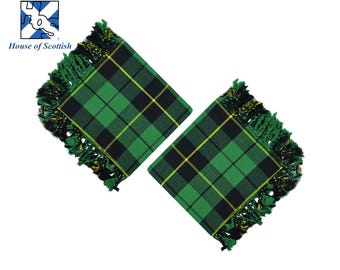 May include: Two green, black, and yellow plaid fabric squares with fringed edges. The squares are folded in half and have a traditional Scottish tartan pattern.