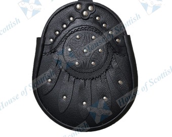 May include: Black leather sporran with a circular design and silver studs. The sporran has a flap that folds down.
