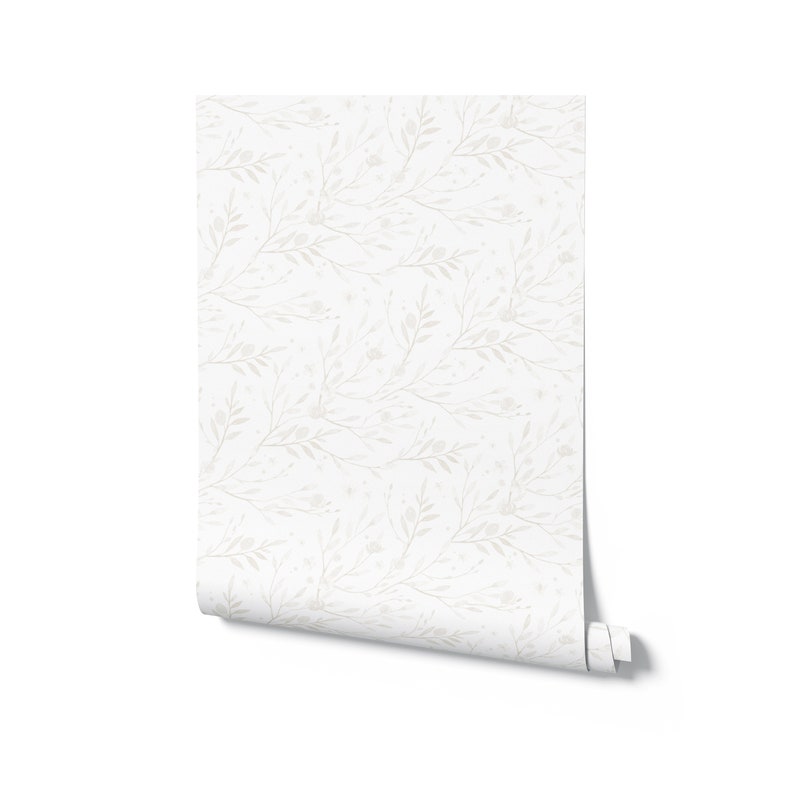 May include: A roll of white wallpaper with a subtle pattern of gray branches and leaves.