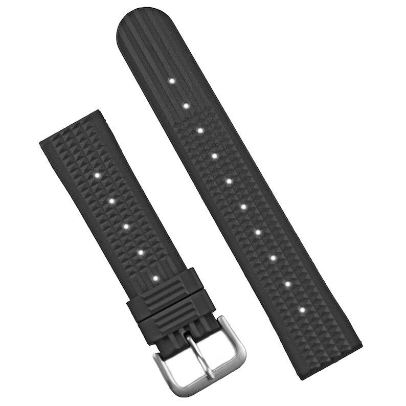 May include: Black watch band with a textured surface and a silver-colored buckle. The band is made of a flexible material and features a diamond pattern. The band has several holes for adjustment.