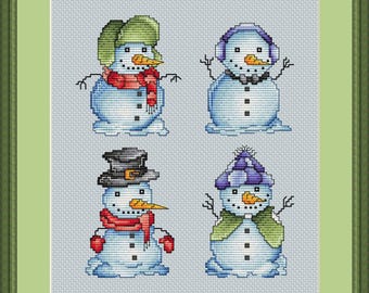 May include: Cross-stitch artwork featuring four snowmen, each with unique hats, scarves, and accessories. The snowmen are set against a light gray background, framed in green. The artwork includes the text "STITCHSPIDER" and the artist's name.