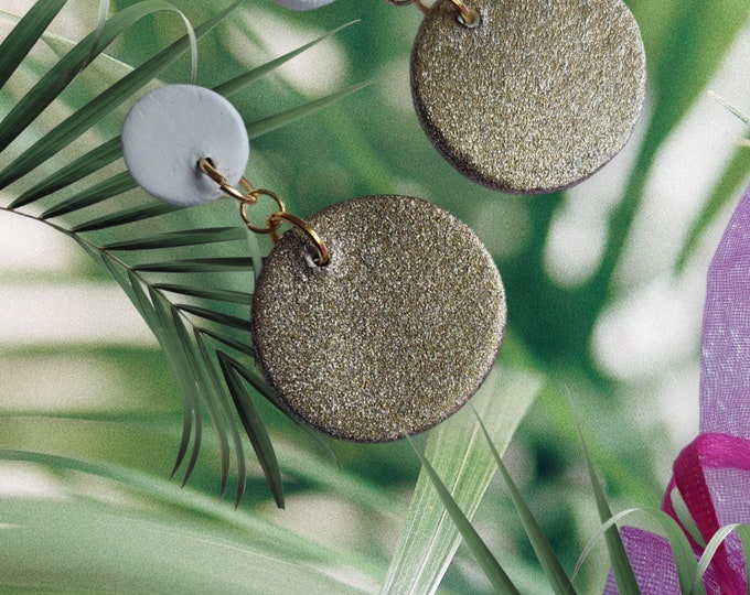 Gold-colored round dangling earrings