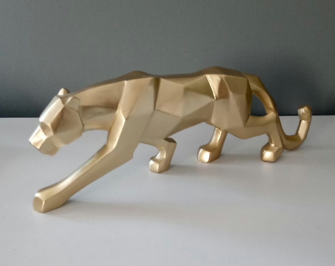 Panther sculpture in gold-colored resin