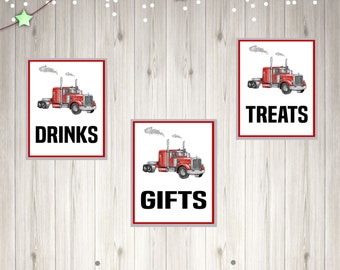 May include: Three red and white signs with a cartoon red semi-truck on each. The signs say "Drinks", "Gifts", and "Treats".