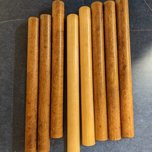8 Bobbin wood pieces great for crafts projects!  10 & 8 inches long.