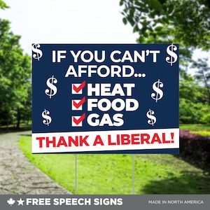 Può includere: Un cartello da giardino blu e rosso con il testo "Se non puoi permetterti... Calore, Cibo, Benzina, Grazie a un liberale!" con simboli del dollaro e segni di spunta accanto a ogni elemento.