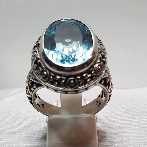 Elaborate ring shops with large authentic sky blue topaz in 925% nickel free silver ( R 16 B.T.)