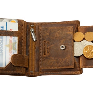 May include: A brown leather wallet with a zipped pocket and a coin pocket. The wallet is open and contains a Costco membership card. The coin pocket is filled with coins.