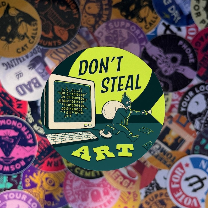 May include: A green and yellow round sticker with the text "DON'T STEAL ART" in a bold, white font. The sticker features a cartoon illustration of a person in a green suit carrying a bag of money and holding a flashlight, running away from a computer screen with code on it.