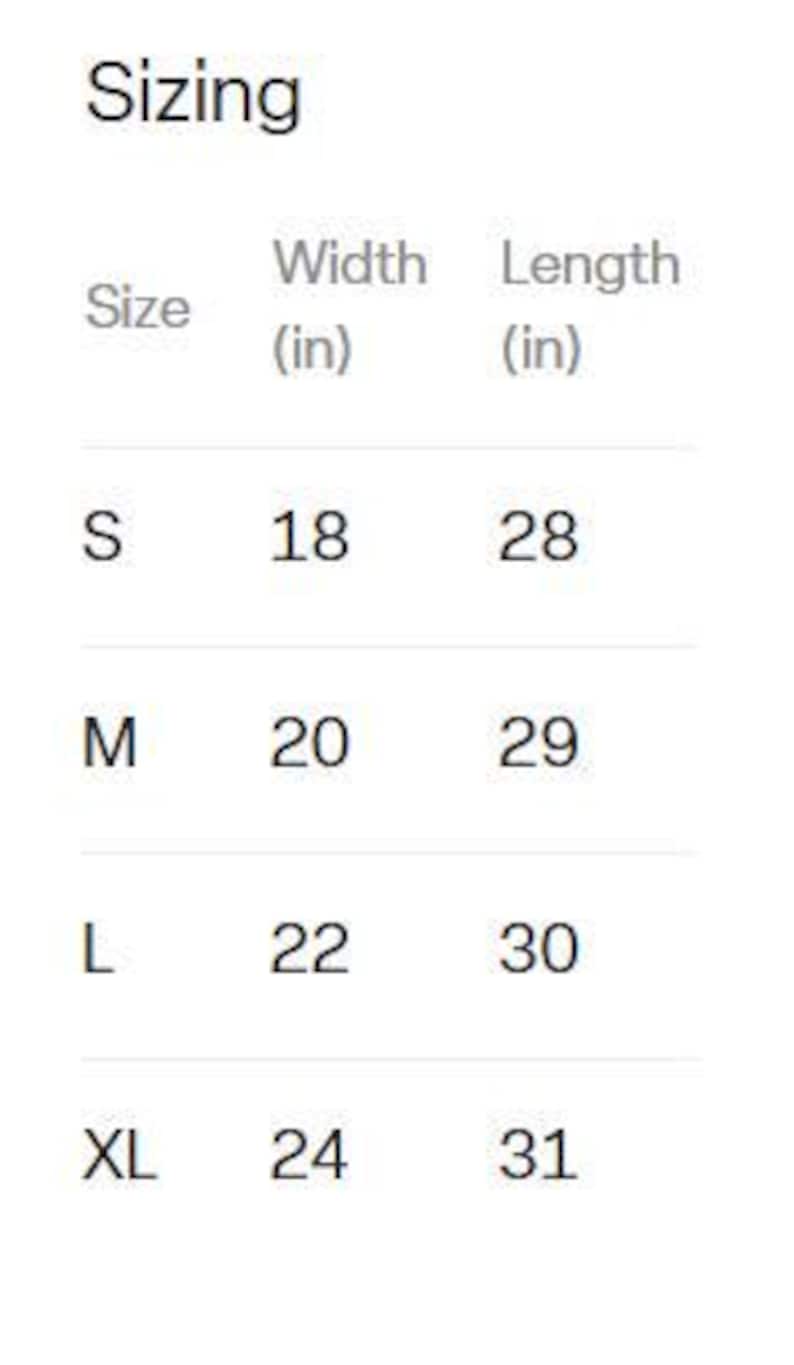 May include: A sizing chart table with the heading Sizing, listing sizes S, M, L, and XL. The table includes columns for Width (in) and Length (in). Measurements are: S 18 by 28, M 20 by 29, L 22 by 30, and XL 24 by 31, all provided in inches.