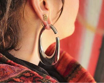 Hoopla earrings for tunnels streached ears Good as ear weights.