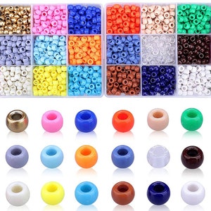 May include: A selection of colourful beads in various sizes and shapes. The top section features small, square beads in a variety of colours, including black, gold, pink, and blue. The bottom section displays larger, round beads in a range of colours.