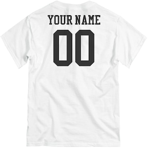 May include: White t-shirt with black text that says "YOUR NAME" and the number "00" on the back.