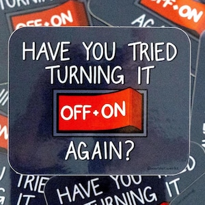 May include: A collection of square stickers with a dark blue background and white text that reads "Have you tried turning it off and on again?" The stickers feature a red switch graphic.