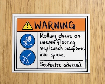May include: A rectangular sticker with a white border and a warning message. The top section is orange with a yellow triangle and the word "WARNING". The text warns about rolling chairs on uneven flooring. Seatbelts advised.