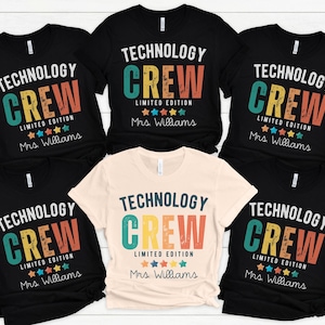 May include: A collection of black and cream-colored t-shirts with the words "TECHNOLOGY CREW LIMITED EDITION" printed in a colorful, retro font. The name "Mrs. Williams" is printed below the text, along with star graphics.