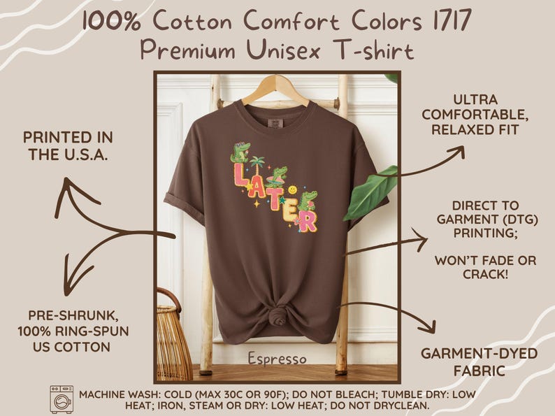 May include: Espresso-colored unisex t-shirt with the word "LATER" in colorful letters and cartoon alligators. The shirt is made of pre-shrunk, ring-spun US cotton and is garment-dyed. Printed in the U.S.A. with direct to garment printing.