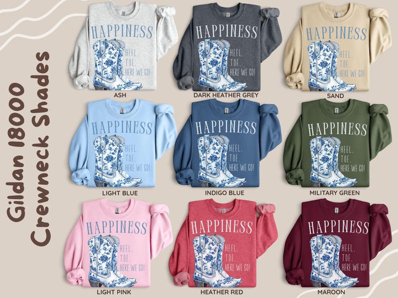 May include: Crewneck sweatshirts in a range of colours, each with a graphic of a blue and white floral cowboy boot and the text "HAPPINESS". Colours include ash, dark heather grey, sand, light blue, indigo blue, military green, light pink, heather red, and maroon.