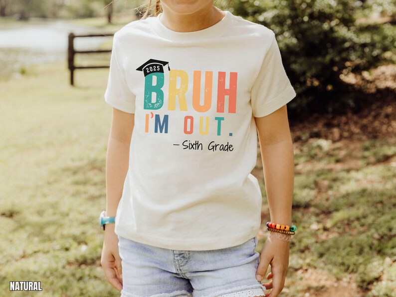 May include: White t-shirt with a rainbow colored graphic that says "Bruh I'm Out. - Sixth Grade" and a graduation cap with the year 2025 on it.