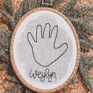 Hand embroidered child handprint