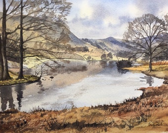 May include: Watercolor painting of a serene landscape featuring a calm lake reflecting the sky and surrounding trees. The artwork showcases a muted color palette of browns, blues, and grays, with bare trees and distant hills. The painting evokes a sense of tranquility.