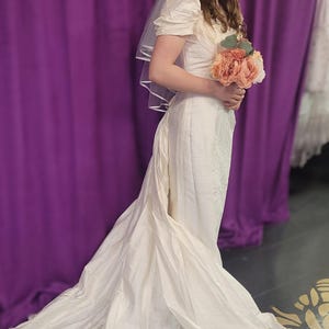 Sweet vintage 100 percent silk bridal gown with detachable train, darling rosettes & a pearl neckline. Sample size 8. Never been worn. image 3