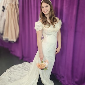 Sweet vintage 100 percent silk bridal gown with detachable train, darling rosettes & a pearl neckline. Sample size 8. Never been worn. image 1