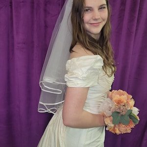 Sweet vintage 100 percent silk bridal gown with detachable train, darling rosettes & a pearl neckline. Sample size 8. Never been worn. image 2