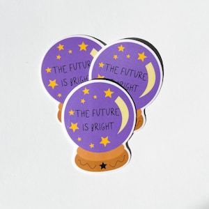 May include: Three purple and yellow stickers with a crescent moon and stars. The stickers feature a magic eight ball design and the text "The Future is Bright".