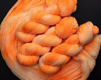 Creamsicle-Hand dyed Superwash Merino Sock Yarn, 80/20 merino/ nylon 115g, 418 yards Neon Orange, Black Light Reactive