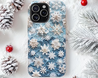 May include: A smartphone case featuring a detailed pattern of white and light blue paper quilled snowflakes layered over a swirling blue and white background. The design includes various intricate snowflake shapes and curled paper elements.