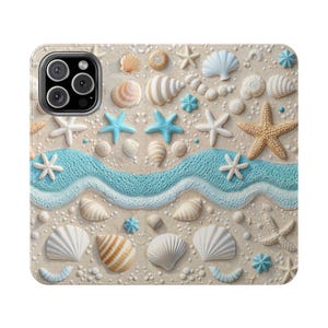 May include: A phone case featuring a beach-themed design. The case is covered in seashells, starfish, and a blue wave pattern, all set against a sandy background. Various shell shapes and sizes are scattered across the surface, creating a textured, coastal aesthetic.