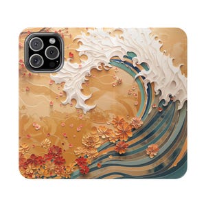 May include: A phone case featuring a stylized Japanese wave design. The artwork includes a large white wave, layered paper flowers, and a warm color palette of orange, gold, and blue. The case has a camera cutout.