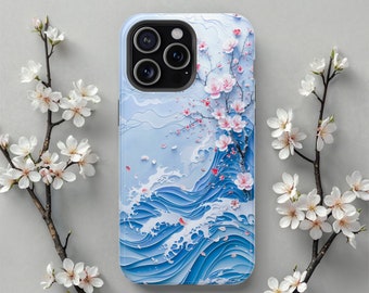 May include: A smartphone case featuring a layered paper-cut style design of blue ocean waves and a cherry blossom branch with pink flowers. The case has a black camera module cutout at the top left, surrounded by white cherry blossom branches.