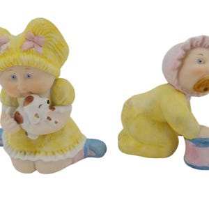 Cabbage Patch Kids Porcelain Figurines Girl with Puppy and Baby with Drum Marked and Has Original Stickers