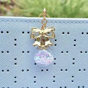 White star candy dangle charm | charm, stars, bow, candy, white, candy charm, planner charm, pearlescent, cute, cute charm, gumball charm