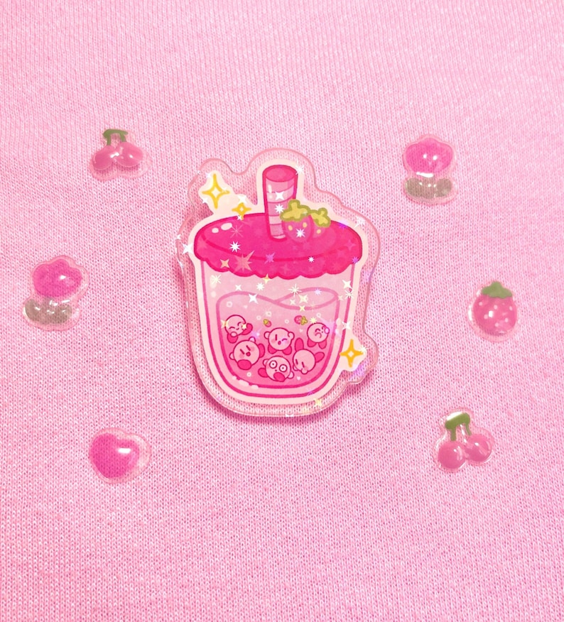 Kirb-boba holographic acrylic pins | pins, boba, kirby, poyo, acrylic, strawberry, orange, cute, sparkles, drawing, stars, gold Strawberry boba