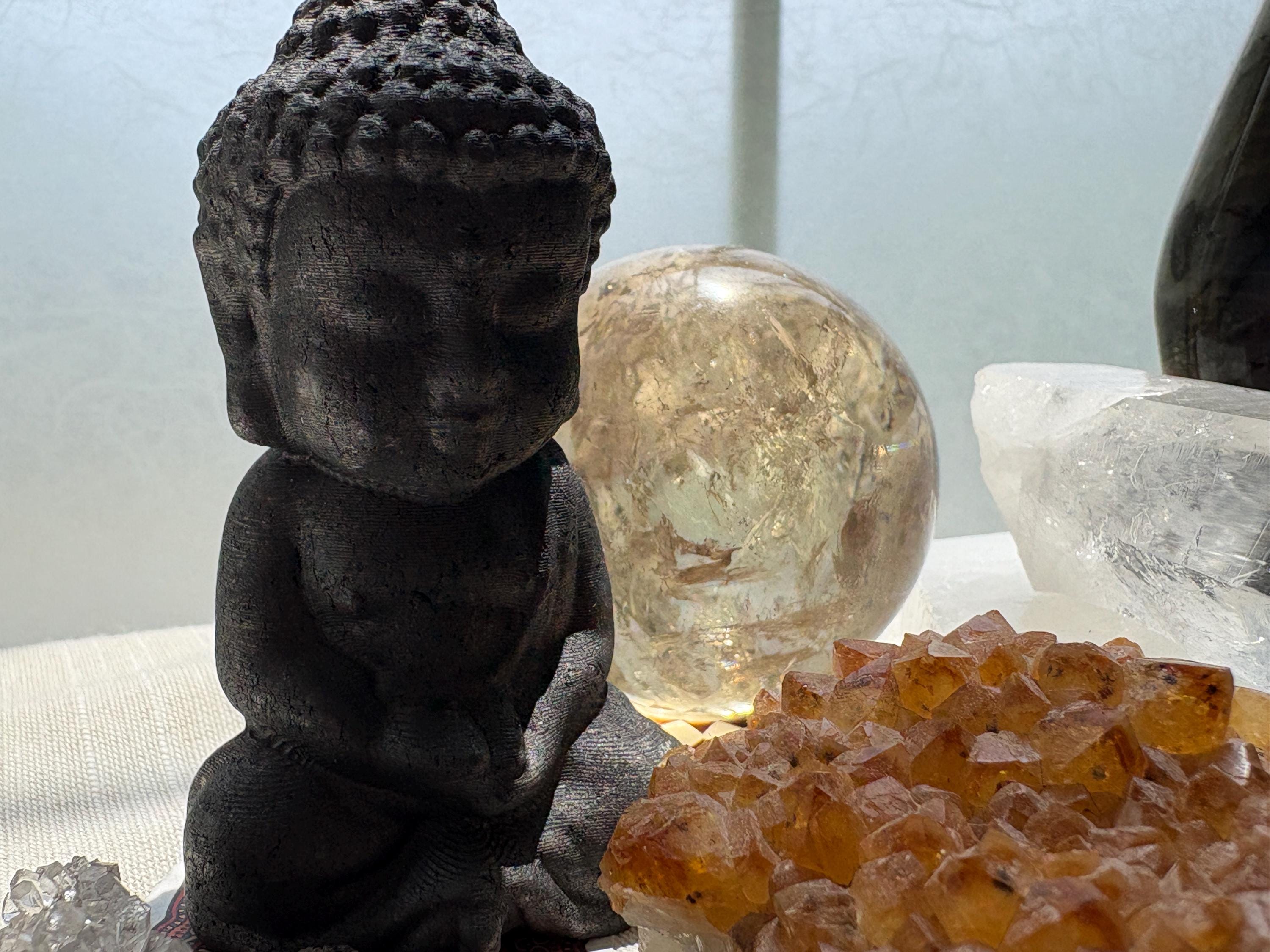 Bodhi – Black Shungite Buddha Statue, Palm-Sized Crystal Companion | Celestial Alignments