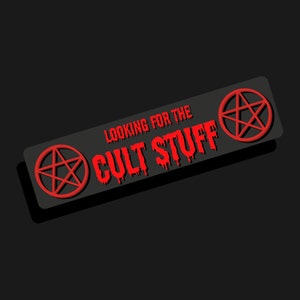 May include: Black and red sticker with a pentagram and the text "Looking for the Cult Stuff".